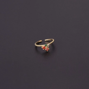 Detailed close-up of cherry fruit ring with red crystals and adjustable beaded gold band