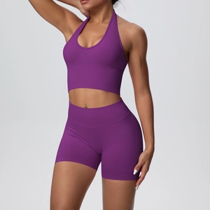 Detail of seamless knit fabric on dark purple halter sports bra and high waist shorts set