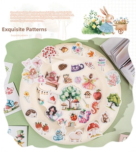 Detailed close-up of decorative watercolor stickers featuring magic forest and fairytale themes