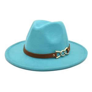 Classic blue wool fedora hat with brown leather band and gold chain on white background
