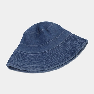 Detail shot of navy denim bucket hat showing high-density stitched brim texture