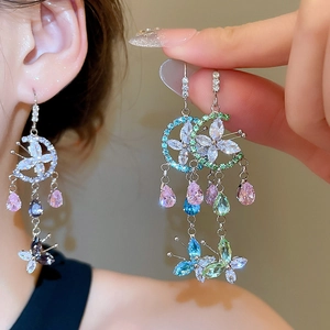 Close-up of luxury flower tassel earrings featuring colorful zircon and butterfly charms