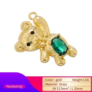 18K gold plated brass bear pendant with green zircon gemstone and detailed fur texture