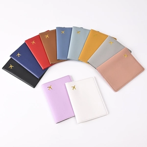 Detailed fan layout of PU leather passport covers with gold airplane embossing in 11 colors