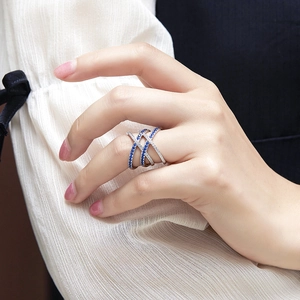 Macro shot of 925 sterling silver multilayer ring with blue and white zircon pavé