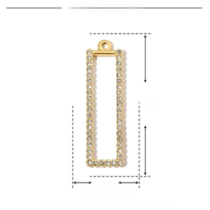 Macro shot of gold stainless steel rectangular pendant with sparkling rhinestones details