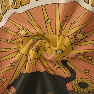 Close-up of bohemian tapestry fabric featuring retro sun, black cat, and sunflowers