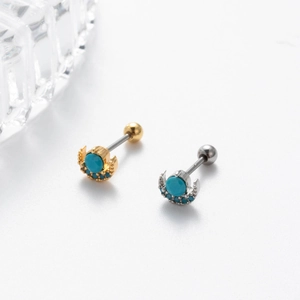 Golden and silver crescent moon stud earrings with turquoise stones on white background