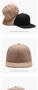 Detail view of floral leaf embroidery on premium twill cotton snapback caps in khaki and black