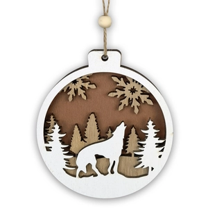 Detail of multi-layer wooden Christmas ornament featuring carved wolf and forest motif