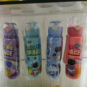 Detailed view of four colorful cartoon astronaut water bottles with straw lids