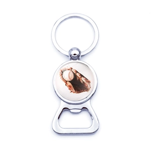 Detail of metal baseball bottle opener keychain with glossy silver finish on white background