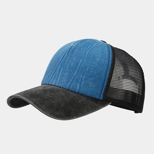 Detail view of washed denim trucker hat with breathable mesh back and double stitching