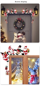Detailed close-up of a wooden Santa Claus door frame corner decoration with Merry Christmas sign