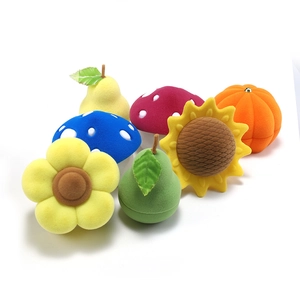 Colorful velvet jewelry boxes in fruit and flower shapes like pear and mushroom