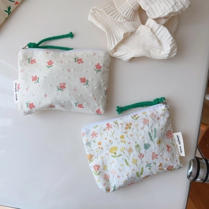 Floral cotton mini storage pouch with green woven zipper puller for coins and makeup