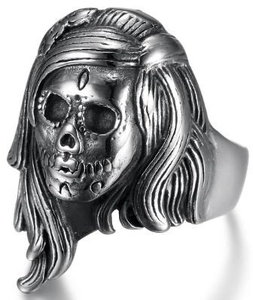 Detailed close-up of a vintage gothic punk skull ring in antique silver stainless steel