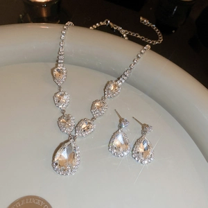 Detailed view of luxury teardrop jewelry set with sparkling crystals and silver finish