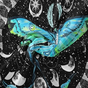 Close-up of Bohemian moth tapestry showing detailed fabric texture and lunar phases print