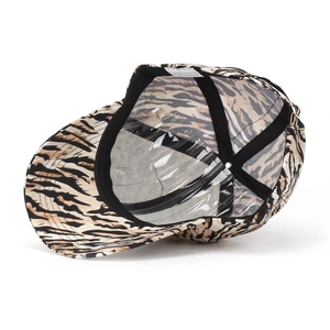 Internal detail of tiger print baseball cap showing sweatband and 100% polyester wash label