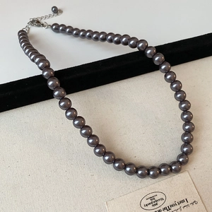 Elegant dark grey pearl necklace with metallic luster and adjustable silver lobster clasp
