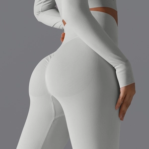 Detailed texture of high-waisted seamless scrunch butt yoga leggings in light gray