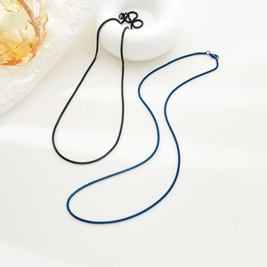Elegant minimalist box chain necklaces in deep black and vibrant gem blue finishes