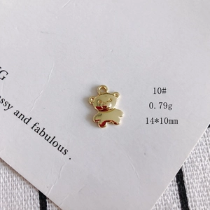 Detailed view of a 14x10mm hollow bear robot charm in gold plating for DIY jewelry