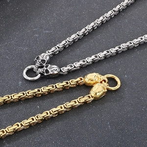 Byzantine chain necklace with skull clasps in gold and silver finish on stone
