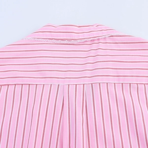 Close-up of pink striped shirt back featuring white lace collar trim and pleat detail