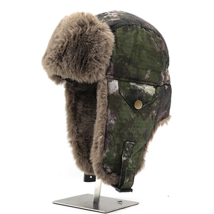 Winter camouflage trapper hat with warm brown faux fur lining and ear flaps for cold weather