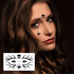 Detail of Halloween spider face tattoo stickers with black skull and branch eyeliner patterns