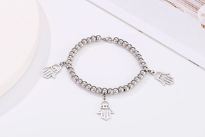 Silver bead bracelet featuring three detailed Hamsa Hand charms on a clean background