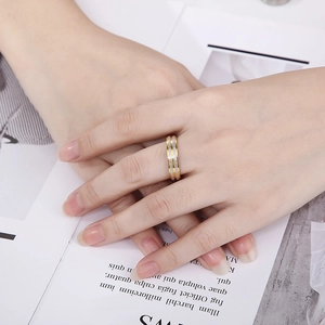 Two-tone stainless steel ring with gold edges and silver frosted glitter texture