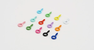 Detailed top view of colorful spray-painted screw eye pins in various vibrant shades