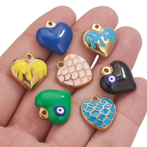 Set of seven heart-shaped stainless steel pendants with enamel and dragon scale patterns