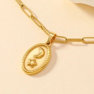 Gold stainless steel paperclip chain necklace with embossed star and moon oval pendant
