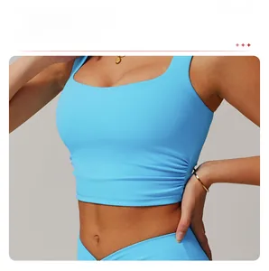 Detail of light blue sports vest with side drawstring ruching for waist shaping