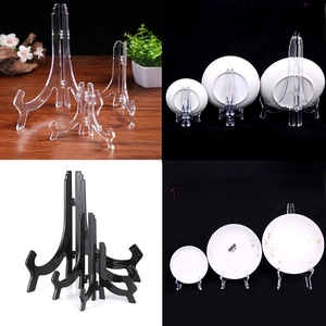 Multiple sizes of clear and black plastic display stands for plates and frames