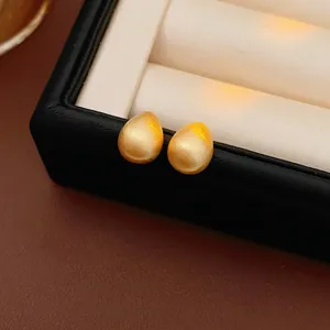 Gold plated waterdrop stud earrings with matte brushed finish in elegant jewelry box