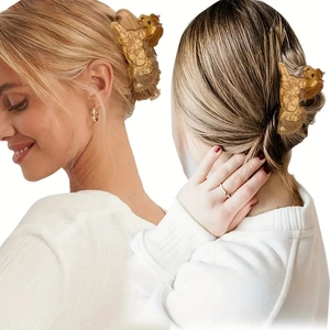 Yorkshire Terrier hair claw clip in brown acetate shown on hair from side and back views