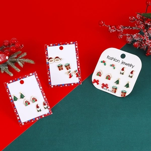 Detail of Christmas earring set with Santa Claus, Christmas tree and gift box motifs