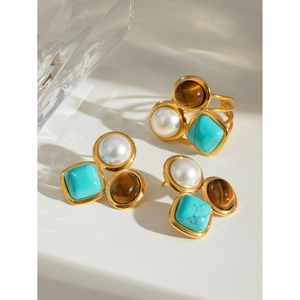 Detail of vintage gold earrings and ring set with pearl, turquoise and tiger eye stone