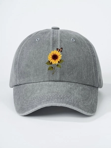 Detail of sunflower and butterfly embroidery on a vintage grey washed cotton baseball cap