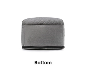 Detailed bottom view of gray quilted portable diaper bag showing fabric texture and base