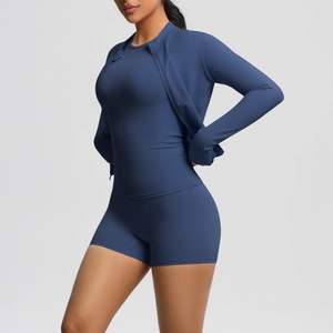 Close-up of navy blue 3-piece yoga set with zip jacket, top, and high waist shorts