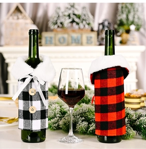 Close-up of red and black buffalo plaid wine bottle covers with faux fur collars