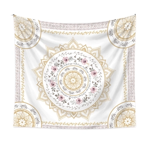 Detailed close-up of mandala tapestry with golden floral patterns and pink roses