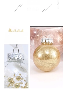 Detail of transparent Christmas ball with gold beads and silver metal hanging cap