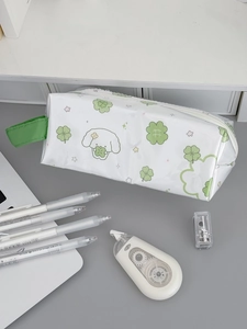 Close-up of waterproof PVC pencil case featuring green puppy prints and ribbon handle